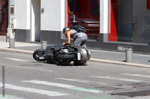 Man Pick Up His Fallen Motorcycle