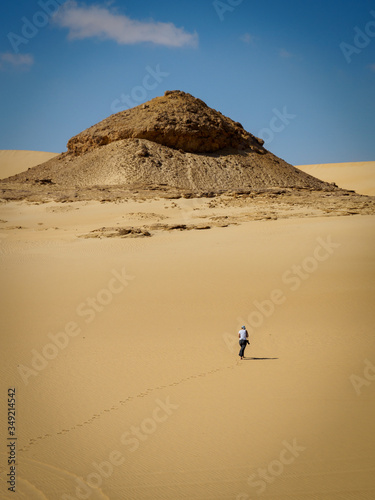 a woman taking a walk in the amazing desert near Siwa, Egypt