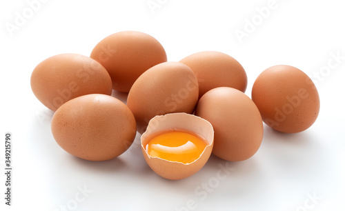 Eggs and broken eggs placed on a white background