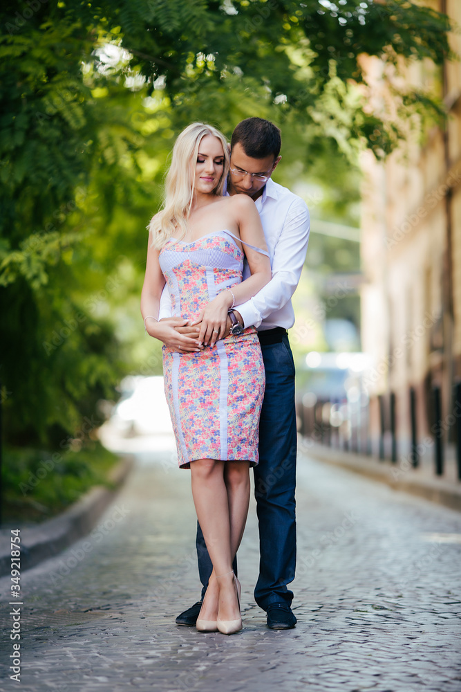 beautiful couple on city background posing, full height