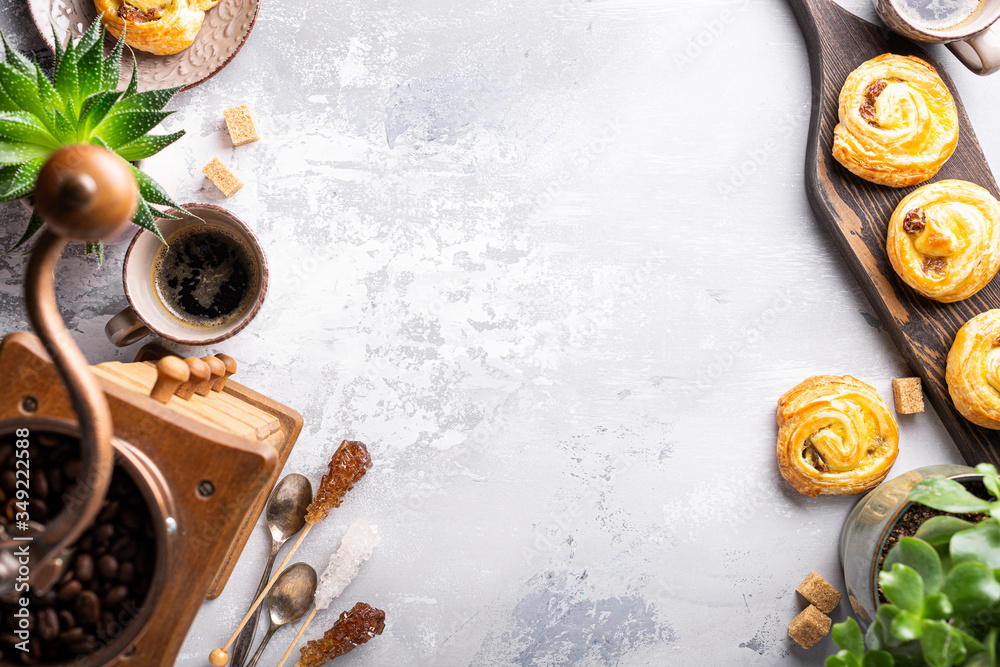 Fresh pastry sweet swirl buns with raisins on wooden board for breakfast or brunch and coffee. Party food concept. Top view, copy space. Fresh pastry sweet swirl buns with raisins on wooden board for breakfast or brunch and coffee. Party food concept. Top view, copy space.