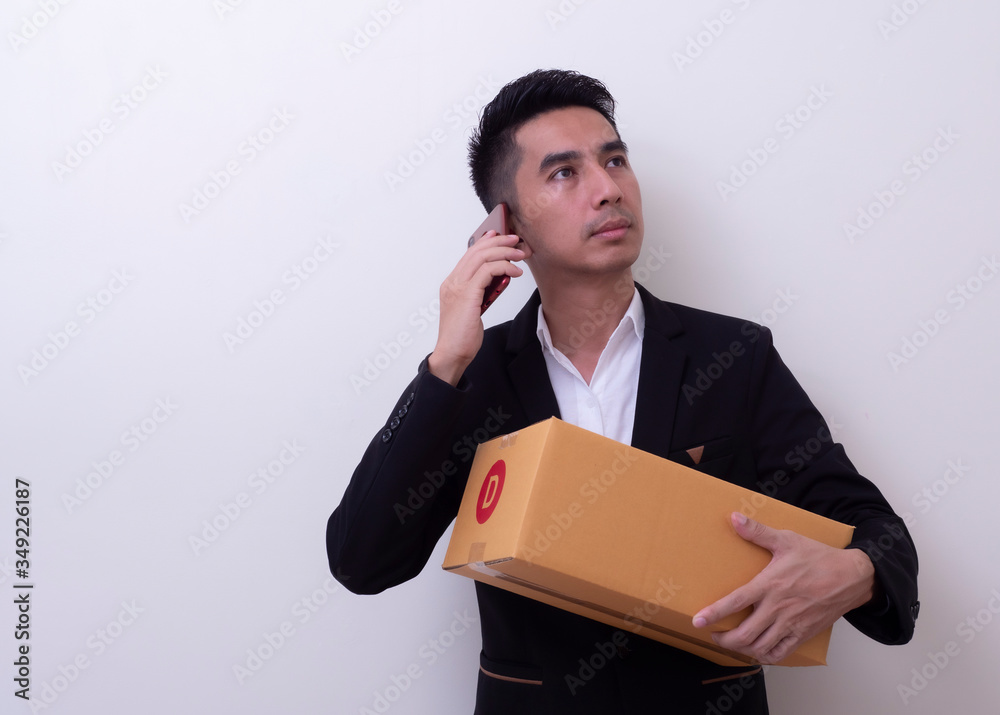 Shipper young Asian man holding cardboard box Shipper young Asian man holding cardboard box