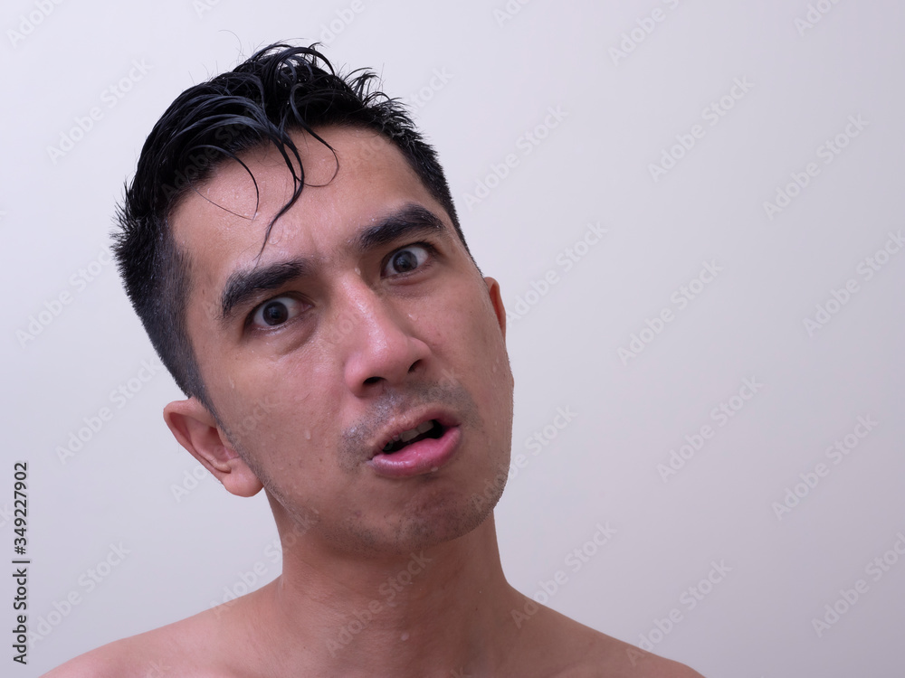 Fototapeta premium Young handsome man taking a bath