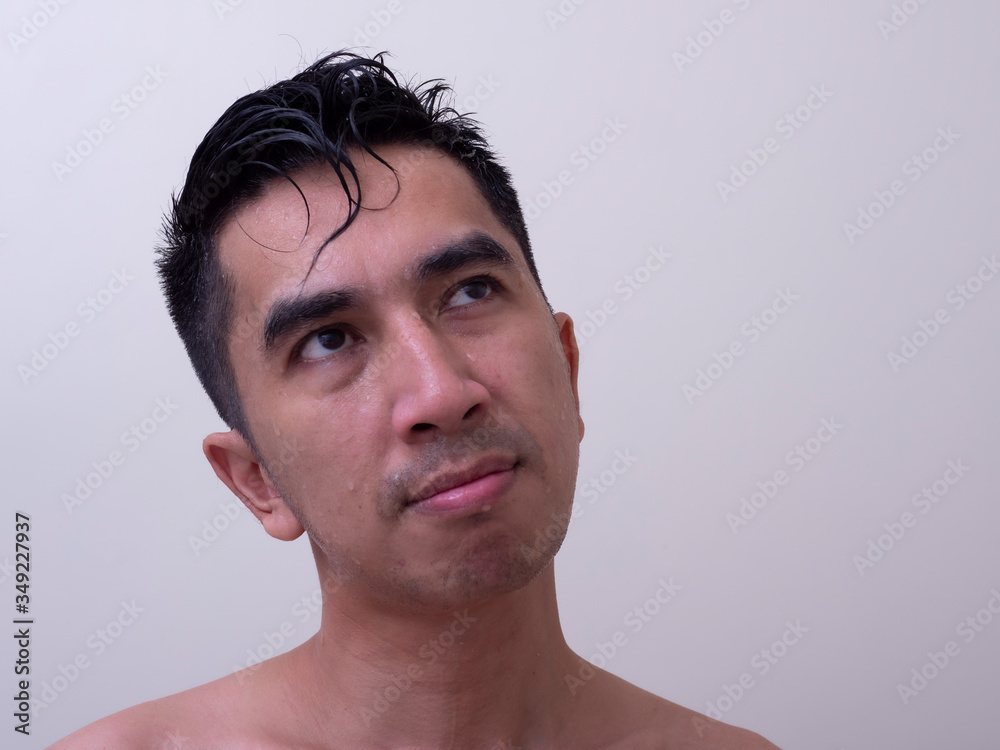 Fototapeta premium Young handsome man taking a bath