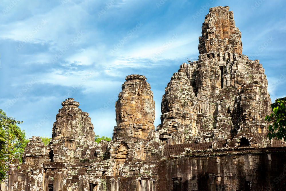 Smiling stone faces Khmer ancient Angkor Wat in Krong Siem Reap  Cambodia