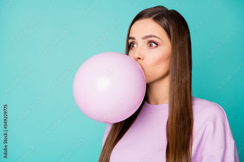 Photo of crazy lady blowing air balloon prepare decorations surprise birthday party holiday practicing breathing exercises wear violet sweater isolated teal color background Photo of crazy lady blowing air balloon prepare decorations surprise birthday party holiday practicing breathing exercises wear violet sweater isolated teal color background