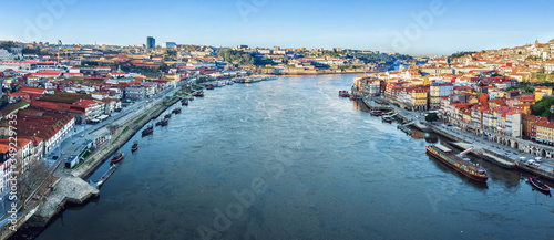 View of the city of Porto from the Eiffel Bridge early in the morning at dawn, small multicolored houses of the Ribeira Quarter