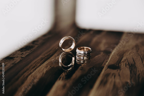 wedding rings on a wooden table