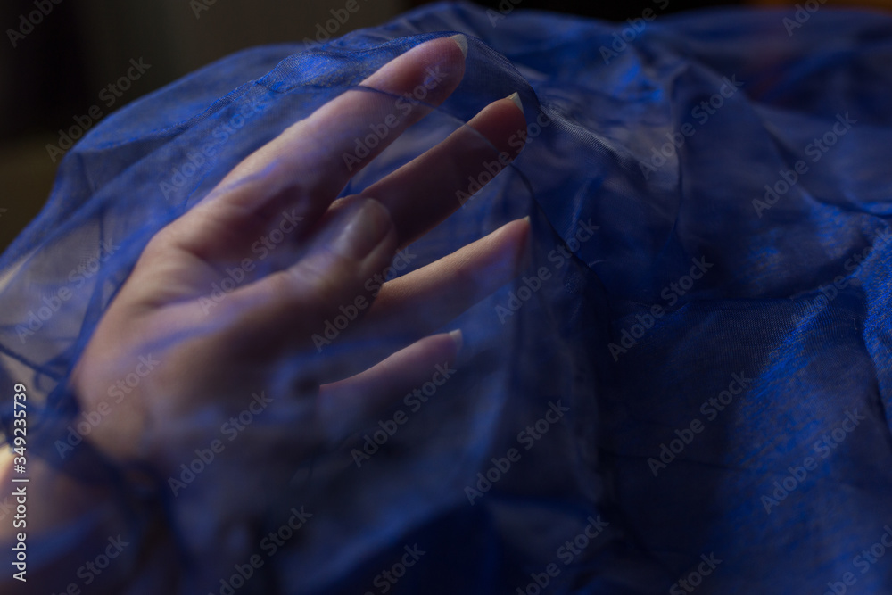 blue background light fabric texture and hand