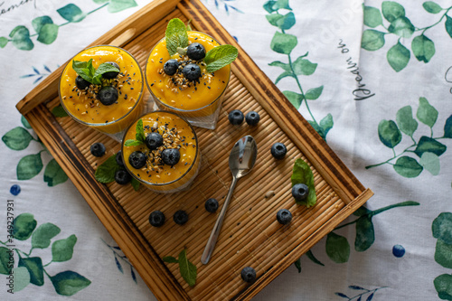 Fresh mango smoothie with blueberries. Healthy diet nutrition. Vegetarian healthy food. Homemade chia pudding. Superfood for strong immunity. Concept of vegetarian breakfast