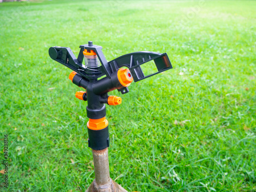 Springer is doing Watering plants and lawns in the garden