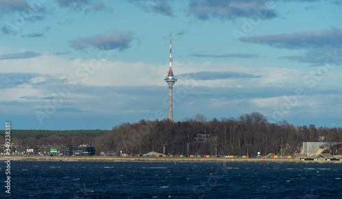 View of the TV tower in Tallinn from the sea in clear sunny weather photo