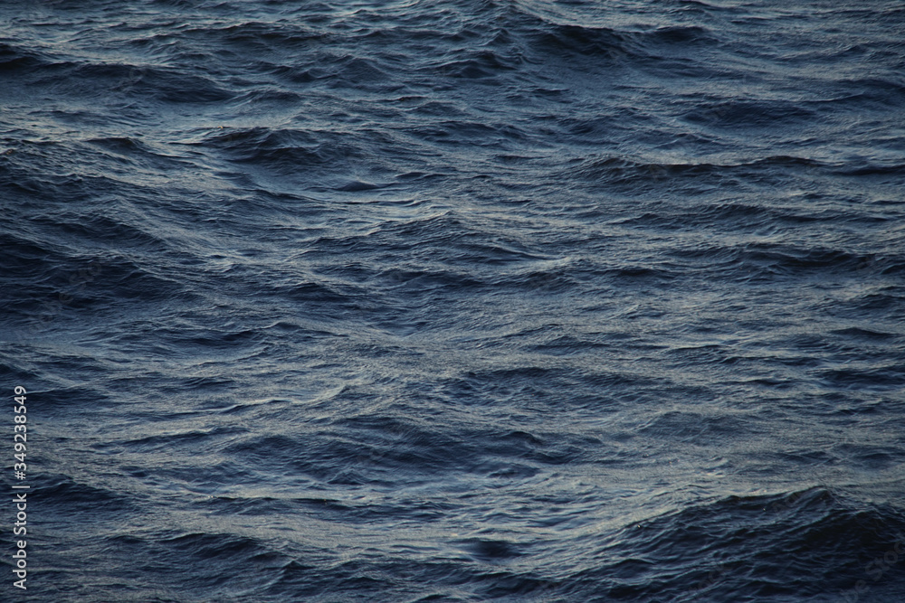 Small waves in the sea at sunset Small waves in the sea at sunset