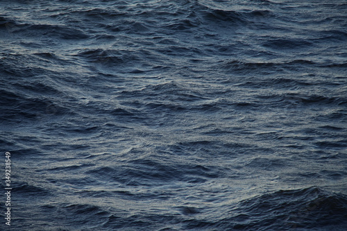 Small waves in the sea at sunset