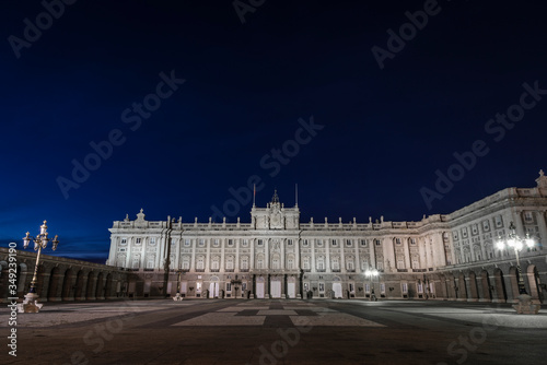View of the front of the royal palace in Madrid at night, with its lighting. Spain. photo