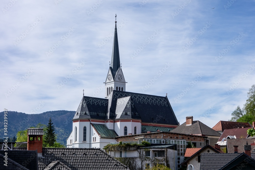 Old white Saint Martin Church in Bled, Slovenia hidden behind buildings in this European city Old white Saint Martin Church in Bled, Slovenia hidden behind buildings in this European city