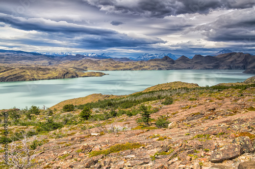 Epic beauty of the landscape - the National Park Torres del Paine in southern Chile. Lago Nordernskjold and mountains in the background photo