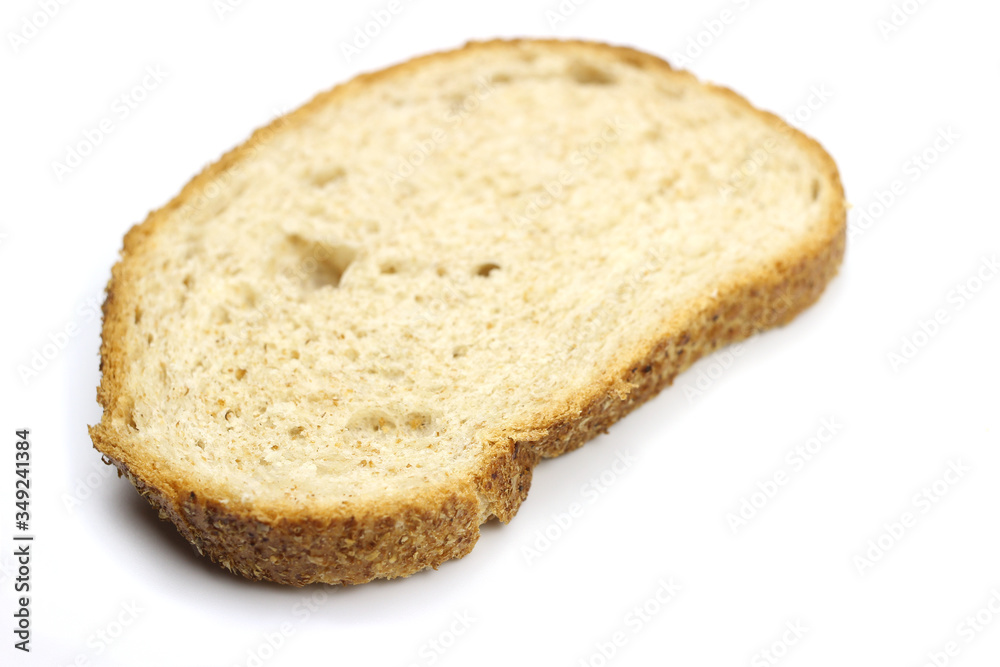 A piece of bread is isolated on a white background A piece of bread is isolated on a white background