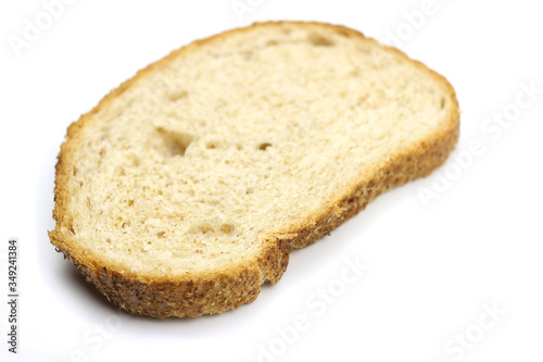 A piece of bread is isolated on a white background