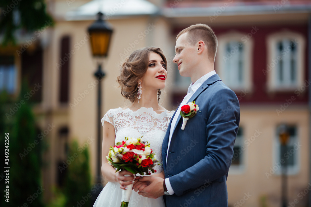 Wedding couple, happy newlyweds and husband hugging in green park.