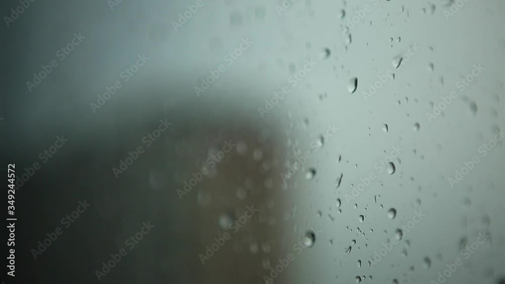 Raindrops on the window. Water drops on a glass. Rainy weather Raindrops on the window. Water drops on a glass. Rainy weather