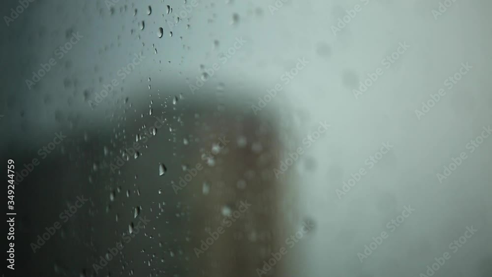 Raindrops on the window. Water drops on a glass. Rainy weather Raindrops on the window. Water drops on a glass. Rainy weather