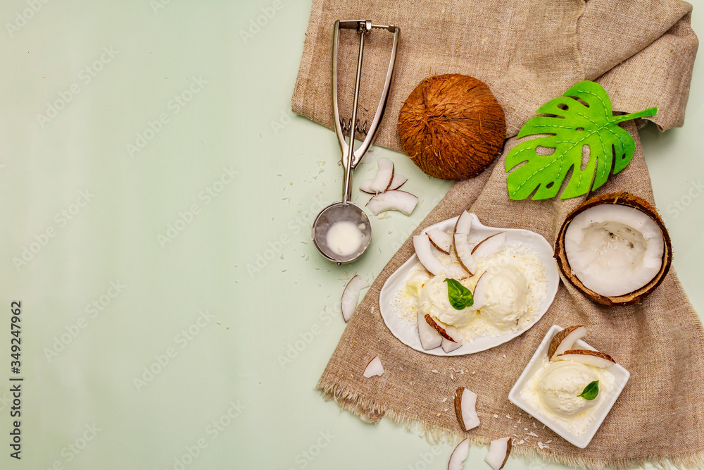 Lactose free coconut ice cream. Special spoon, halves of fruit, flakes Lactose free coconut ice cream. Special spoon, halves of fruit, flakes