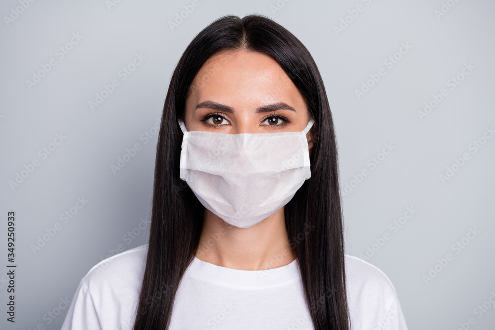 Portrait of serious girl corona virus infection patient want stop bio danger bacteria spreading wear medical mask clothes isolated gray color background Portrait of serious girl corona virus infection patient want stop bio danger bacteria spreading wear medical mask clothes isolated gray color background