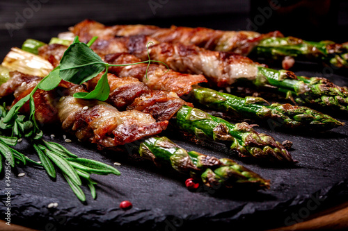 Grilled green asparagus wrapped with bacon. Ketogenic diet. Healthy food, diet menu. Top view, overhead, banner