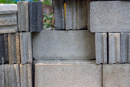 White bricks of equal size, are the materials used in building construction.