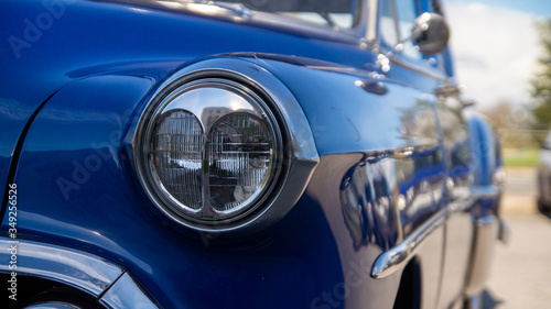 Front light of a blue vintage Chevrolet