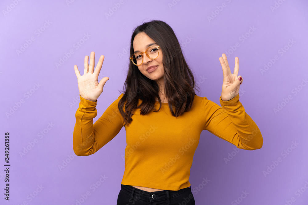Young mixed race woman isolated on purple background counting eight with fingers Young mixed race woman isolated on purple background counting eight with fingers