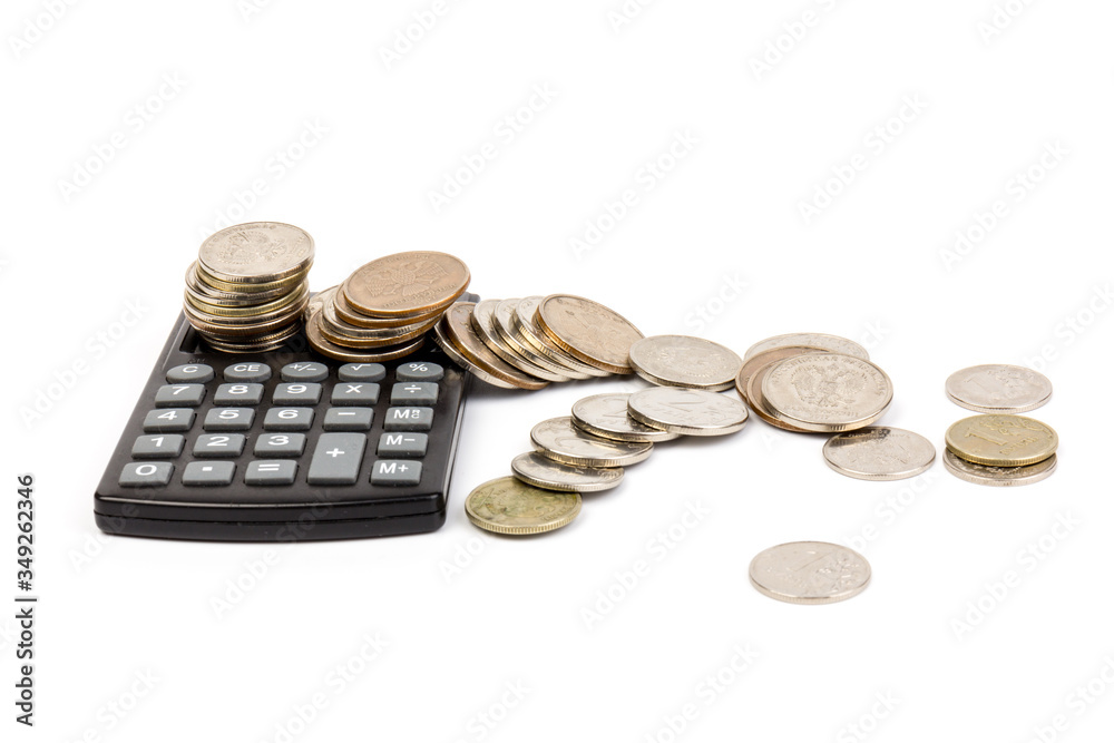 The stack of coin with calculator on white background, concept of calculating expenses, incomes and expenses. The stack of coin with calculator on white background, concept of calculating expenses, incomes and expenses.