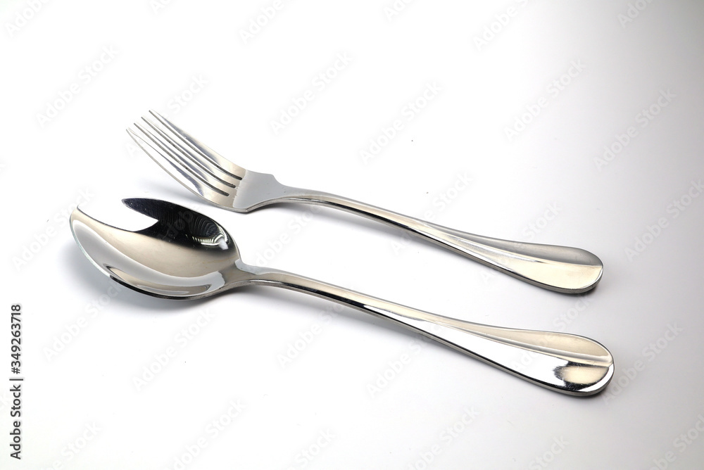 Spoon and spoon sparring on the white ground Spoon and spoon sparring on the white ground