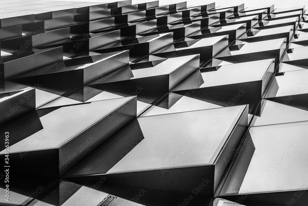 Metallic patterns.
Black and white picture of a set of metallic shapes in line.