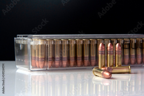 Closeup of a box of .22 high velocity weapon ammunition with bullets in the front. Ammo. photo