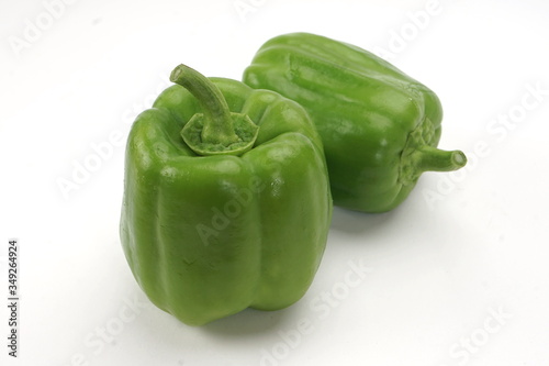 Fresh, green paprika isolated on a white background.