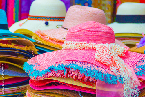 Women's summer straw hat on pastel and colorful. Hat fashion for summer vacation and a photograph to a beautiful woman. - Image