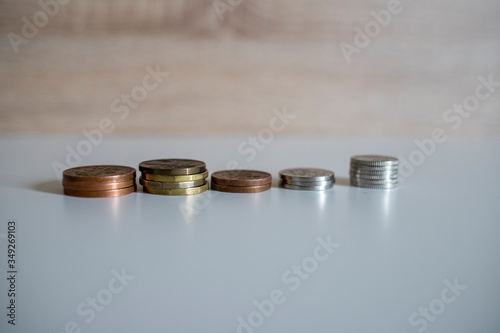 stack of coins on a white background