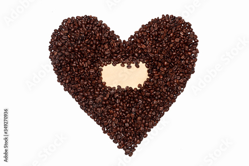 heart-shaped coffee beans. Coffee background or texture with an empty space for an inscription, text, or logo. Heart shape from coffee shops on an empty white background