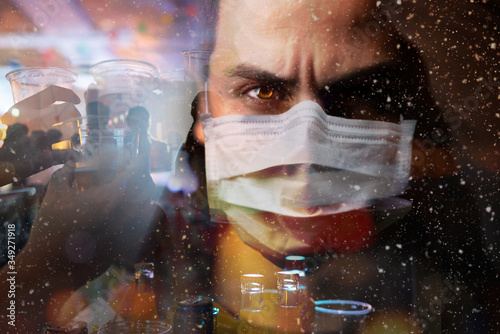 Image of the man wearing surgical mask with stress mood double exposure with night party, Concept Risky to take coronavirus or covid-19 when people hang around together and too much closely.  