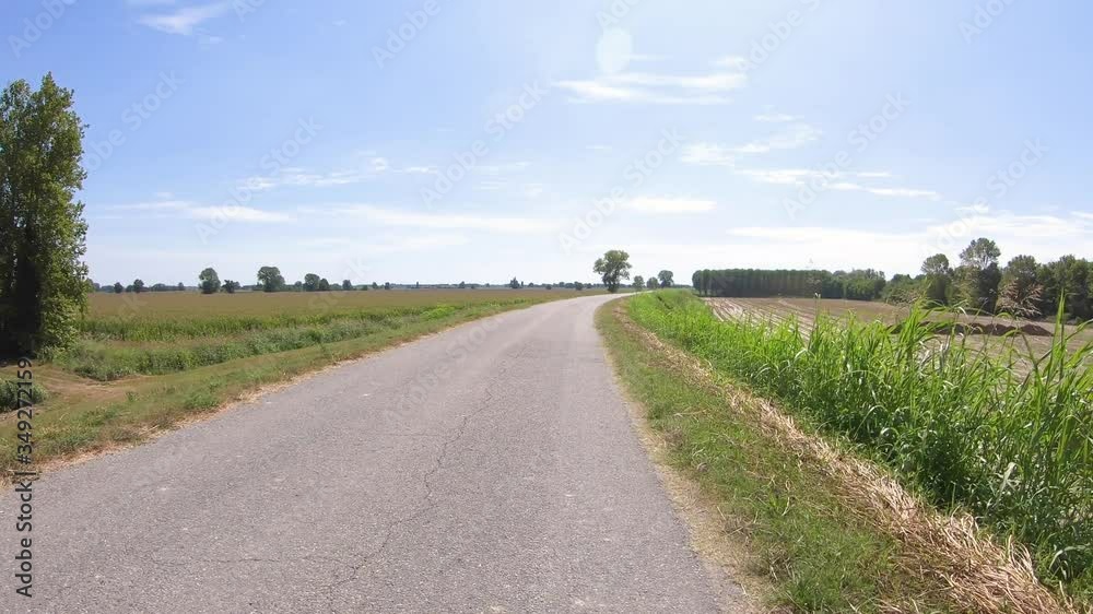 Ciclovia del Po bicycle path on the Embankment along the Po river next to Corte Sant'Andrea village, municipality of Senna Lodigiana, province of Lodi, Lombardy, Italy Ciclovia del Po bicycle path on the Embankment along the Po river next to Corte Sant'Andrea village, municipality of Senna Lodigiana, province of Lodi, Lombardy, Italy