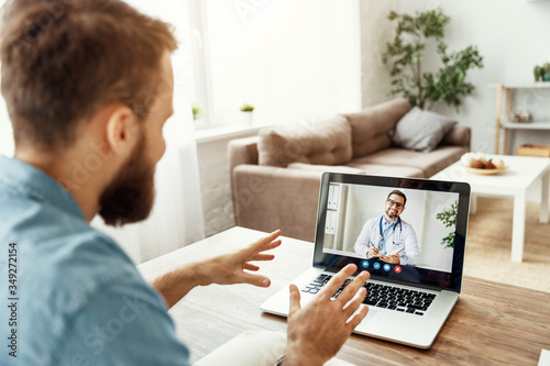 Video conference video chat with a doctor online. © JenkoAtaman