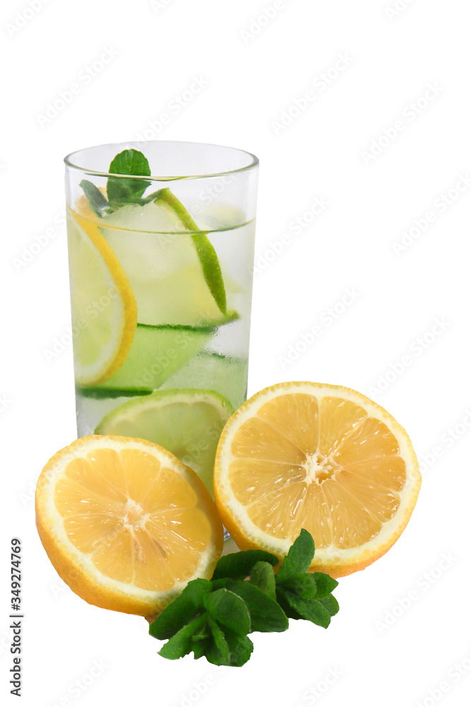 Chilled summer drink lemonade in a glass cup with ice, yellow lemon and mint leaves. homemade lemonade to quench your thirst in the heat. isolate on white, selective focus. Chilled summer drink lemonade in a glass cup with ice, yellow lemon and mint leaves. homemade lemonade to quench your thirst in the heat. isolate on white, selective focus.