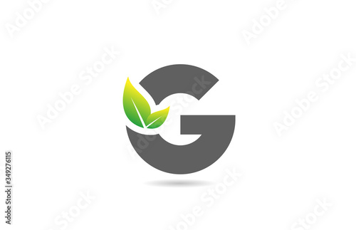 green grey G alphabet letter logo icon for company and business with leaf design