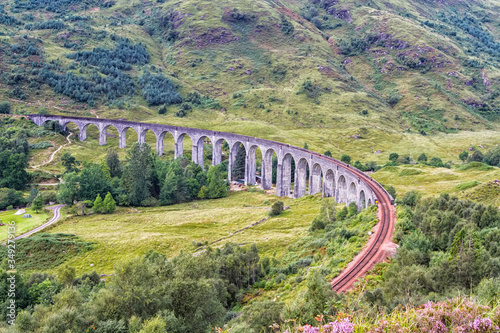 The Glenfinnan viaduct during summertime on the westcoast of Scotland, United Kingdom photo