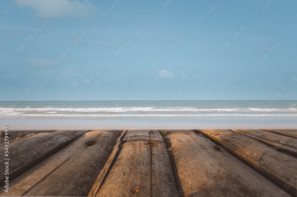 Top of wood table on sea background. Concept of beach in summer. Table space of wood .