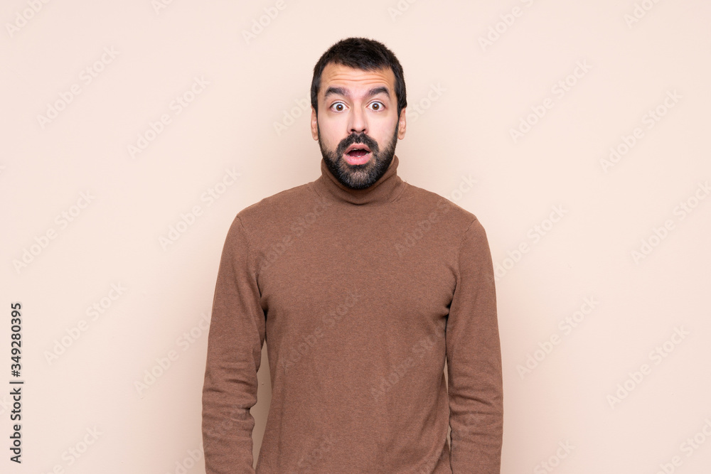 Man over isolated background with surprise facial expression Man over isolated background with surprise facial expression