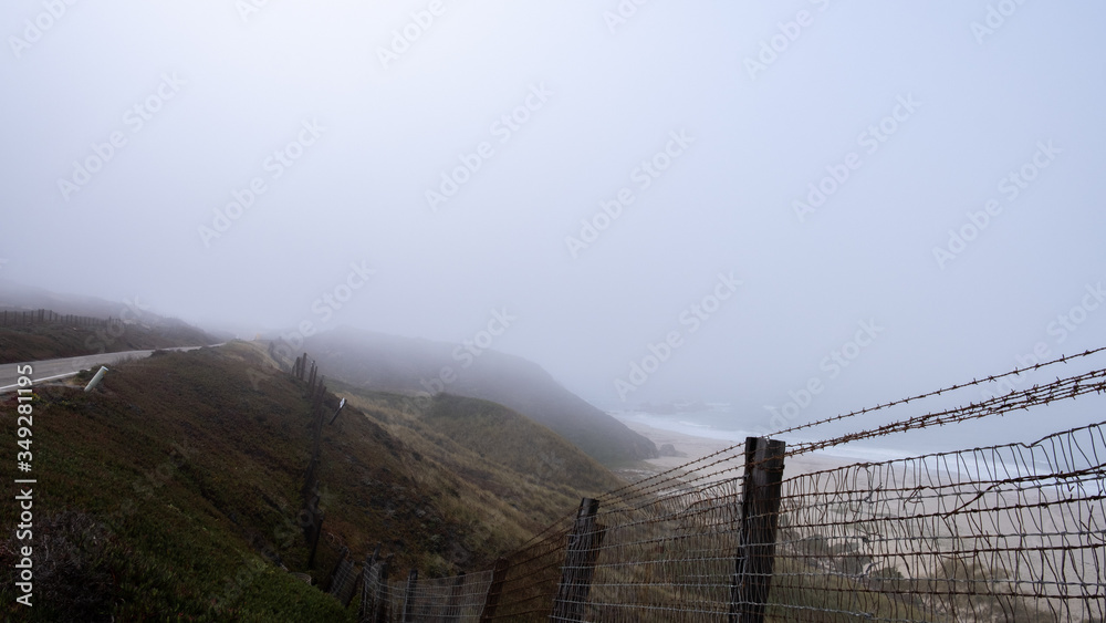 wire fence in the mist, west coast california wire fence in the mist, west coast california