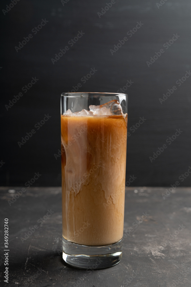 Iced coffee with cream on the rustic background. Selective focus. Shallow depth of field. Iced coffee with cream on the rustic background. Selective focus. Shallow depth of field.